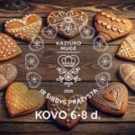 Kaziuko mugė 2026 Vilniuje: tradicinė meduolinė širdis ant amatininko prekystalio pavasario šventės šurmulyje senamiestyje.